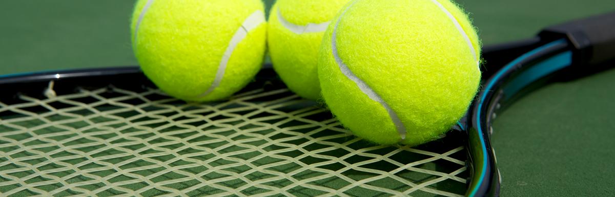 Three Tennis Balls on a Racquet