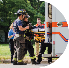 Firefighters loading ambulance