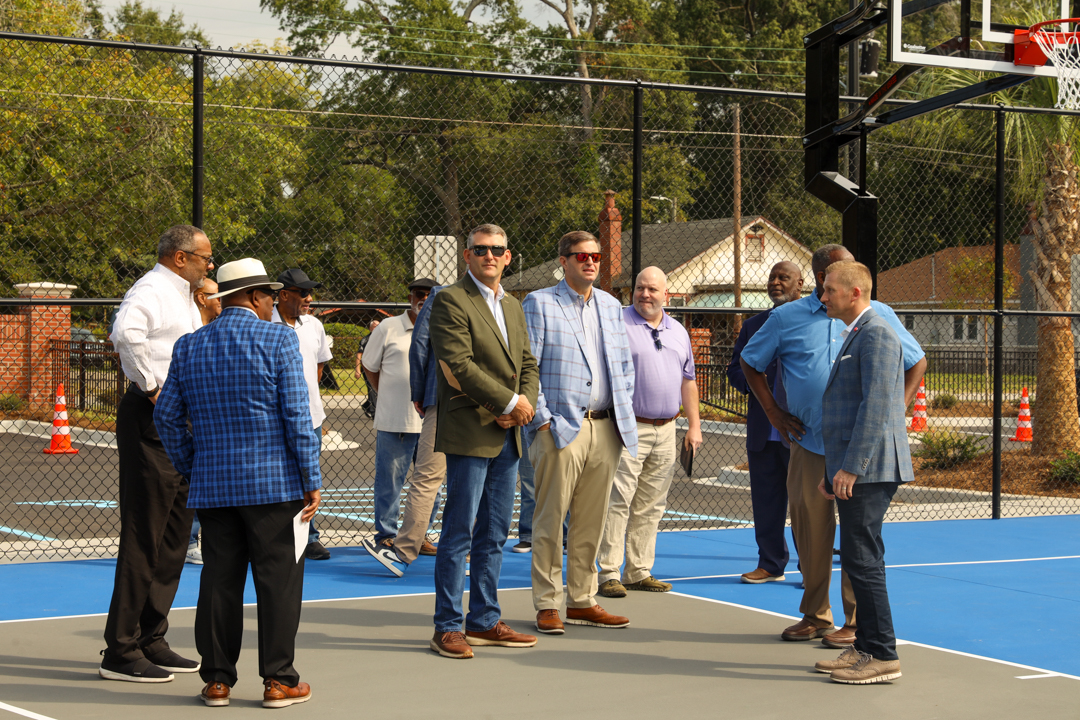 Local leaders mingling on the basketball courts of Westend Pakr